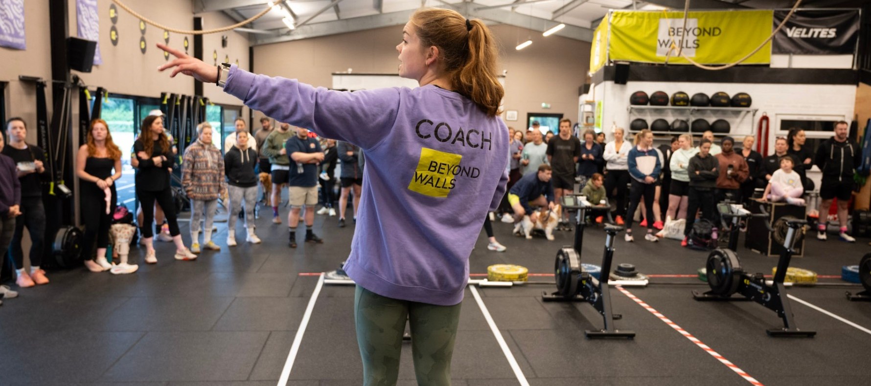 Coach working with a mixed-ability class, effort, smiles, community
