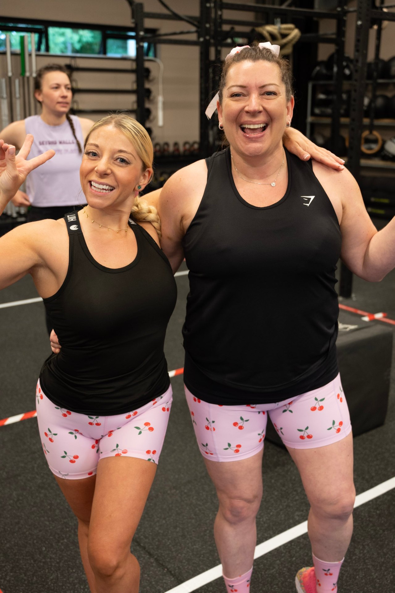 Two members laughing together after training